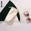 Bolsa para gafas negra cuerda de cordón de bisel suministro directo de fábrica bolsa para gafas de sol de tela compuesta accesorios coloridos para teléfono móvil bolsa de PU imprimible