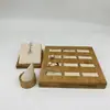 Estante de almacenamiento de anillos de tela de gamuza de madera de bambú personalizado, juego de exhibición de anillos de 12 ranuras, accesorios de exhibición