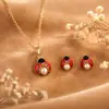 Collar tridimensional creativo y lindo de moda europea y americana con incrustación de perla personalizada y aretes de aleación de mariquita colorida con goteo de aceite