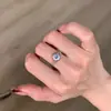 Anillo de Cadena para Dedos Xiaohongshu Más Vendido, Ajustable, Plata Cepillada, Azul Luna de Frijol, con un Diseño Fresco y Delicado, Disponible para Dropshipping