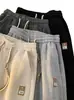 Pantalones de chándal waffle de marca de moda transfronterizos para hombre, pantalones deportivos rectos de estilo callejero americano para primavera y otoño con caída, pantalones casuales para hombre