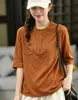 2026 Outono Inicial Novo Produto Estilo Coreano Camiseta Solta de Gola Redonda com Manga Média para Mulheres Cor Sólida Solta Camisa Base com Gola Meio Aberta MHMHT