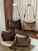 Bolsa de ombro retrô de alta aparência, novo modelo outono 2026, grande capacidade, design de nicho, adequada para trabalho e deslocamento, bolsa de mão para usar sob o braço
