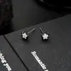 Brincos Cluster de Diamante Cheio de Novo Estilo Transfronteiriços para Homens, Modernos e Versáteis, Brincos de Flor de Íris em Forma de Cruz de Alto Padrão para Mulheres