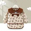 Babero de terciopelo de cristal para bebé, impermeable, antidesgaste, con bolsillo de arroz, para otoño e invierno, delantal para madre y bebé.