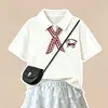 2026 Nuevo Moda Elegante Verano Niñas Top Manga Corta y Falda Pastel de Encaje Versátil Estilo Universitario Conjunto de Dos Piezas