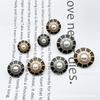 Malla Metálica Xiaoxiang para el Sol Serie de Aceite que Gotea de Cuatro Hojas Traje Superior de Celebridad Botón de Perla Incrustado con Diamante Botón de Aleación