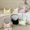 Bolsa Feminina Texturizada de Alto Padrão Transfronteiriça Nova Coleção Primavera 2026 Design de Nicho Simples Bolsa de Ombro ou Axila Bolsa Dumpling