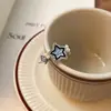 Anillo FANTAI con forma de estrella y perla sonriente para hombre y mujer, con apertura irregular en el dedo índice y estrella de la suerte azul.