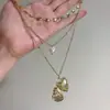 Collar con Colgante de Corazón de Perlas de Múltiples Capas Nuevo Transfronterizo Ins de Aspecto Alto Único Creativo Cadena para Clavícula Que Puede Guardar Fotos