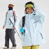 Fornecimento Direto da Fábrica Jaqueta de Esqui à Prova de Vento e Impermeável Três em Um Feminina 2026 Novo Estilo Petite Roupas de Montanhismo e Caminhada ao Ar Livre Masculino