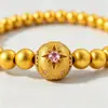 Pulsera de ocho puntas en forma de estrella, con acabado cepillado en oro de arena, adornada con diamantes rosas, cuentas redondas chapadas en oro y detalles de circonita, en un nuevo estilo chino, versátil para cualquier atuendo