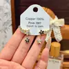 Pendientes de estrella estilo Ins, geniales y elegantes, para mujer, pendientes de botón de lujo ligero, nicho, alta gama, joyería para orejas versátil y de moda, venta al por mayor