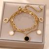 Pulsera transfronteriza europea y americana de acero de titanio para mujer con concha blanca y negra de doble capa, números romanos, lujo ligero, simple, versátil, joyería de mano que no se desvanece