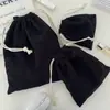 Bolsa de almacenamiento de pana de color liso con cierre de cordón, un juego portátil de tres piezas de gran capacidad y una bolsa de almacenamiento simple