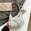 Primavera de 2026 Nova Bolsa Casual Simples de Personalidade em Forma de Meia-Lua Tendência da Moda Bolsa Texturizada Bolsa Transversal de Ombro Único Feminina
