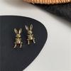 Pendientes de botón de conejo con lazo de nicho de estilo retro de Corea del Sur, con aguja de plata s925 y diseño de celebridades de Internet.