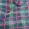 Tela de felpa jacquard de lana de cordero en stock, 500 gramos de lana de cordero para ropa de niños, ropa exterior y ropa del hogar, tela de cachemira granular