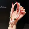 Pulsera de Muñeca de Color Caramelo de Moda Pulsera Corta de Perlas Redondas con Diamantes Venta Caliente Transfronteriza Correa de Mano Antiperdida y Anticaída Estilo Caliente