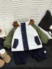Chaqueta de terciopelo para bebé Otoño e Invierno 2025 Nueva Moda Fresca para Niños Pequeños Chaqueta de Moda Cálida con Capucha y Combinación de Colores