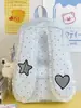Mochila de coelho de orelhas caídas com poá transfronteiriça para estudantes do sexo feminino, novo modelo 2026, mochila de nicho de alta aparência e grande capacidade