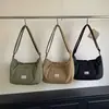 Bolso acolchado de color liso estilo coreano para mujer 2026 Otoño/Invierno Nuevo Tejido de nailon Gran capacidad Ligero para ir al trabajo Bolso de hombro único Cruzado para mujer