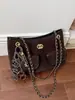 Bolso tote de cadena estilo Chanel pequeño para ir al trabajo sensación de alta gama bolso de un solo hombro gran capacidad nuevo estilo bolso cruzado para mujer bolso cubo