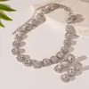 Traje de collar y pendientes de diamante ovalado europeo y americano exagerado luz de lujo alta gama cadena de clavícula nicho moda joyería al por mayor