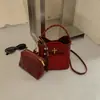 Bolsa Saco Retro Camurça Melanóide Feminina 2026 Outono/Inverno Nova Bolsa de Mão Trançada Pingente de Miçangas Bolsa de Ombro Único Transversal