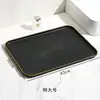 Bandeja rectangular de plástico estilo lujo ligero negro con borde dorado para uso doméstico en la sala de estar, para colocar tazas de té, platos, frutas y bocadillos