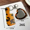 Peine espejo en forma de corazón, colgante de peine de acetato, accesorio de bolso simple y versátil, peine portátil con mango, llavero