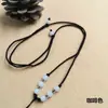 Cuerda de Collar Trenzada Ajustable Unisex Estilo Nacional Cuerda Trenzada Hecha a Mano Cuerda de Collar de Ocho Bolas Cuerda con Colgante Venta al por Mayor
