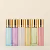 Botella de vidrio con roller de 10 ml de color para venta al por mayor, botella go ball, botella de vidrio, botella vacía, botella para aceite esencial, botella de perfume de vidrio, botella