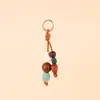 Colgante de Bolsa con Cuentas de Cerámica de Colores Tejido a Mano Piedra Cuentas de Madera Colgante de Bolsa Longxiang Accesorios de Llavero de Moda