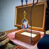 Tangka pintado a mano de Nepal y Tíbet, con el tema de vidas pasadas y presentes, con un juego de collar con colgante de calabaza