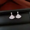 Pendientes de borla con flor de trébol de circonita vintage con un toque de alta gama, pendientes versátiles y de moda al por mayor