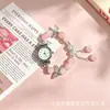 Set de reloj y pulsera de juguete pdd, lujo ligero, versátil para estudiantes de secundaria y preparatoria, reloj de cuarzo con cuentas de mariposa al por mayor