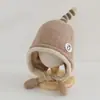 Gorro de lana tejido con protección para los oídos para niños y bebés, transfronterizo, con etiqueta de tela elegante, correas de colores caramelo para niños y niñas