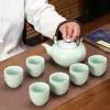 Venta al por mayor Tetera Ru kiln elevable juego de té kung fu cerámica tetera grande taza plana regalo de aniversario de empresa