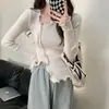 Nuevo estilo de top de punto para mujer, otoño e invierno, corte ajustado, diseño irregular, top base de invierno