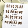 Joyería de uñas transfronteriza, lazo de dibujos animados con cinta de leopardo francesa tridimensional, joyería de uñas DIY al por mayor