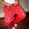 Pantalones de chándal elásticos oscuros de alta costura europeos y americanos, estampados personalizados, pantalones casuales rectos, retro vintage.