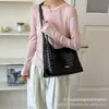 Bolso de axila tejido de nicho transfronterizo para mujer, nuevo modelo 2026, bolso de hombro tipo cubo de gran capacidad, bolso de mano estilo coreano para el trabajo