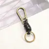 Fabricante Llavero Tejido a Mano Accesorios Hebilla de Escalada Retro Versátil Cuerda de Cuero 25mm Anillo de Llave Colgante DIY