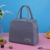 Trabajador de oficina mano llevando bolsa lonchera bolsa aislante de papel de aluminio bolsa de almuerzo de gran capacidad bolsa de almuerzo engrosada de aspecto elegante