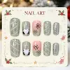 Arte de uñas navideño europeo y americano: purpurina plateada fresca, diseños a rayas, motivos de Papá Noel, copos de nieve negros y rayas blancas; uñas postizas