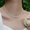 Collar de Perlas Artificiales de una Sola Capa Europeo y Americano Collar de Perlas Ovaladas de Nicho Cadena para Clavícula Joyería de Acero de Titanio Venta al por Mayor