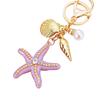 Llavero de Estrella de Mar de Diamante Europeo y Americano para Coche Colgante de Bolso de Metal para Mujer Anillo de Llavero Oceánico Regalo de Negocio Transfronterizo