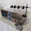 Máquina llenadora semiautomática GFK280 para líquidos cuantitativos de bebidas alcohólicas, aceites esenciales, detergentes para ropa, vidrio y agua, máquina llenadora de líquidos pequeños.