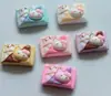 Lindo Kt Caramelo de Chocolate DIY Funda para Teléfono Móvil Pegamento de Crema Parche para Pasador de Pelo Hecho a Mano Imán para Refrigerador Resina de Dibujos Animados